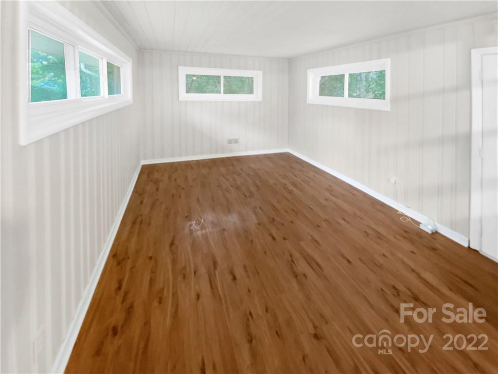 3209 Credenza Road Charlotte, NC 28208 - Photo 12 of 20 a view of a room with wooden floor and windows