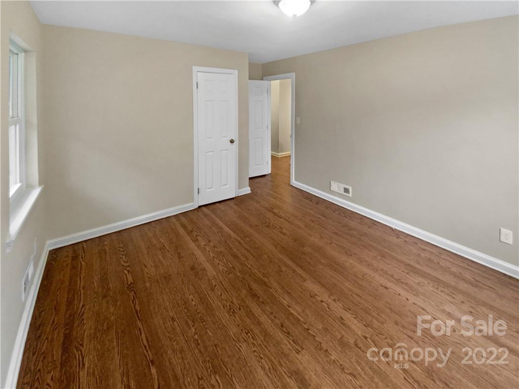 3209 Credenza Road Charlotte, NC 28208 - Photo 16 of 20 a view of an empty room with wooden floor