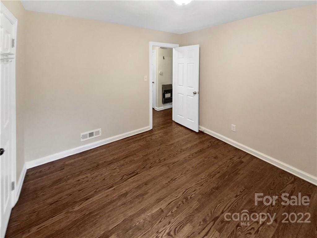3209 Credenza Road Charlotte, NC 28208 - Photo 20 of 20 a view of an empty room with wooden floor