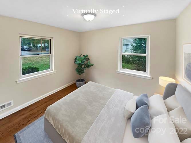 3209 Credenza Road Charlotte, NC 28208 - Photo 4 of 20 a bedroom with bed and a window