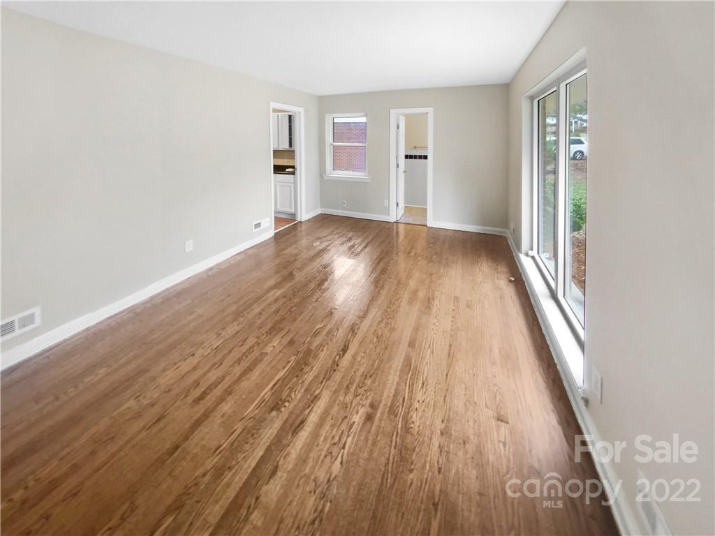 3209 Credenza Road Charlotte, NC 28208 - Photo 9 of 20 wooden floor in a empty room with a window