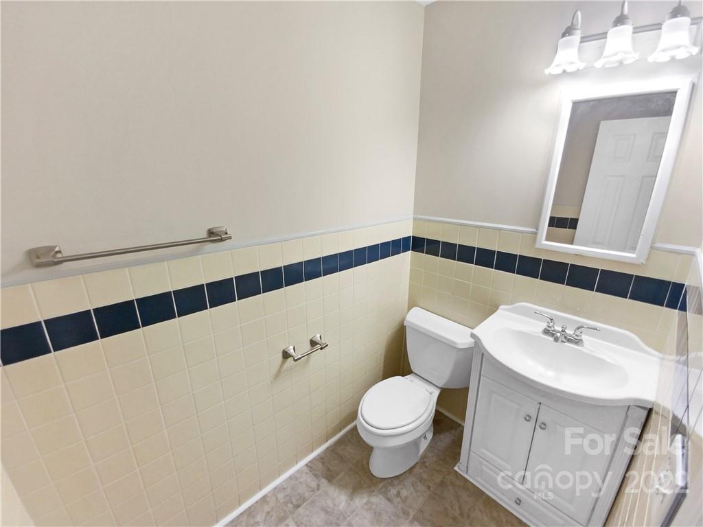 3209 Credenza Road Charlotte, NC 28208 - Photo 10 of 20 a white toilet sitting next to a bathroom sink