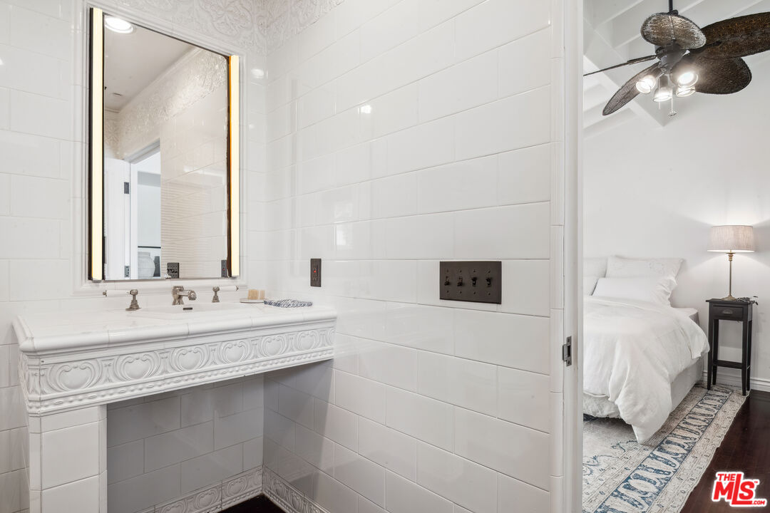 26799 Sea Vista Drive Malibu, CA 90265 - Photo 19 of 32 a en suite bathroom with a double vanity sink and mirror