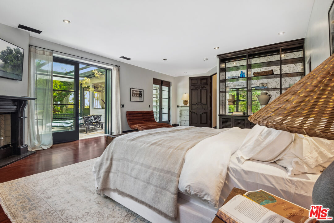 26799 Sea Vista Drive Malibu, CA 90265 - Photo 20 of 32 a bedroom with a large bed and a large window