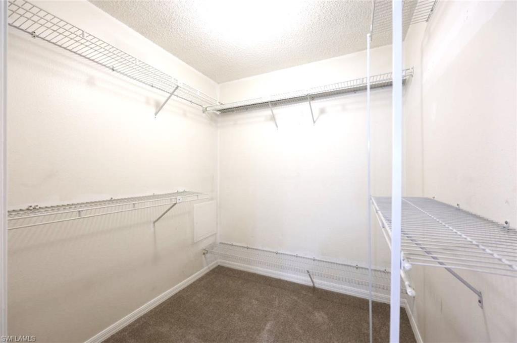 5685 Whitaker Road, Unit 202 Naples, FL 34112 - Photo 18 of 26 Large Primary BR walk-in closet