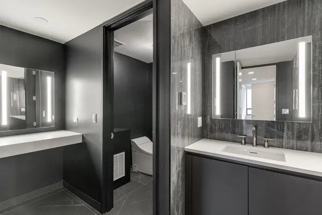 a view of a room with furniture and wooden floor