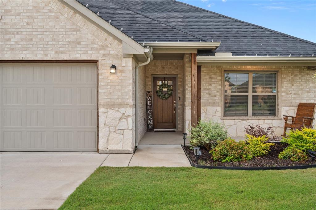 103 Randal Row Corsicana, TX 75110 - Photo 3 of 35 a view of a backyard with potted plants