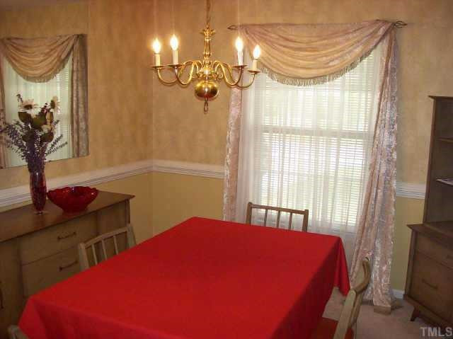 310 Rippling Stream Road Durham, NC 27704 - Photo 10 of 10 Formal dining room with hardwood floors covered with new carpet Other