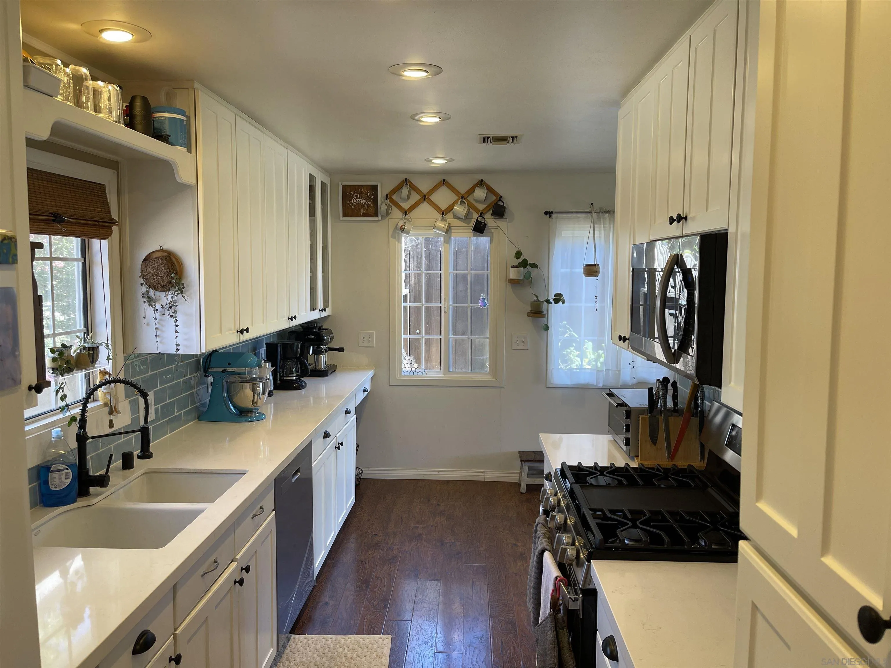 14150 Tobiasson Road Poway, CA 92064 - Photo 3 of 12 a kitchen with a sink stove and refrigerator