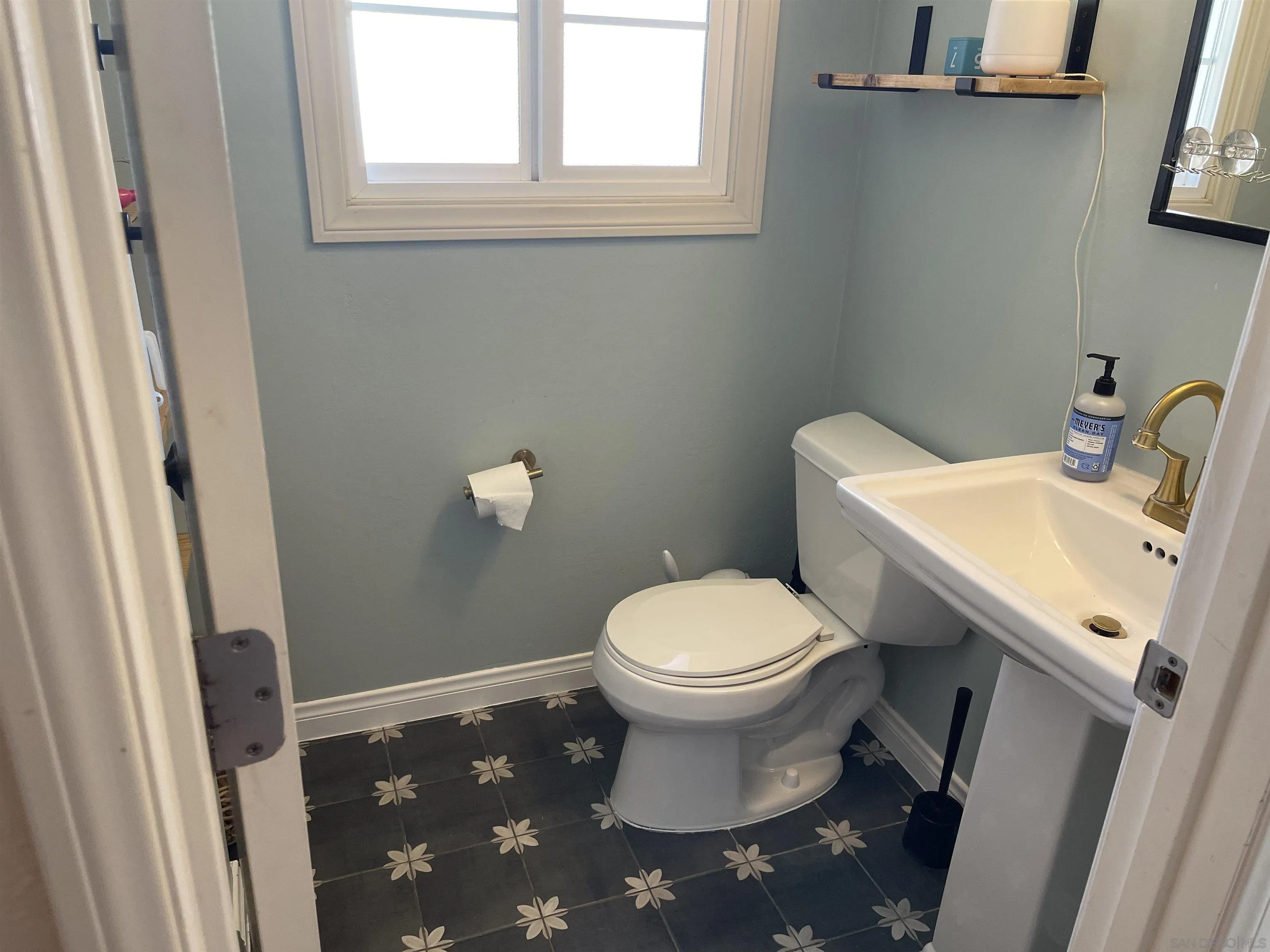 14150 Tobiasson Road Poway, CA 92064 - Photo 6 of 12 a white toilet sitting next to a bathroom sink