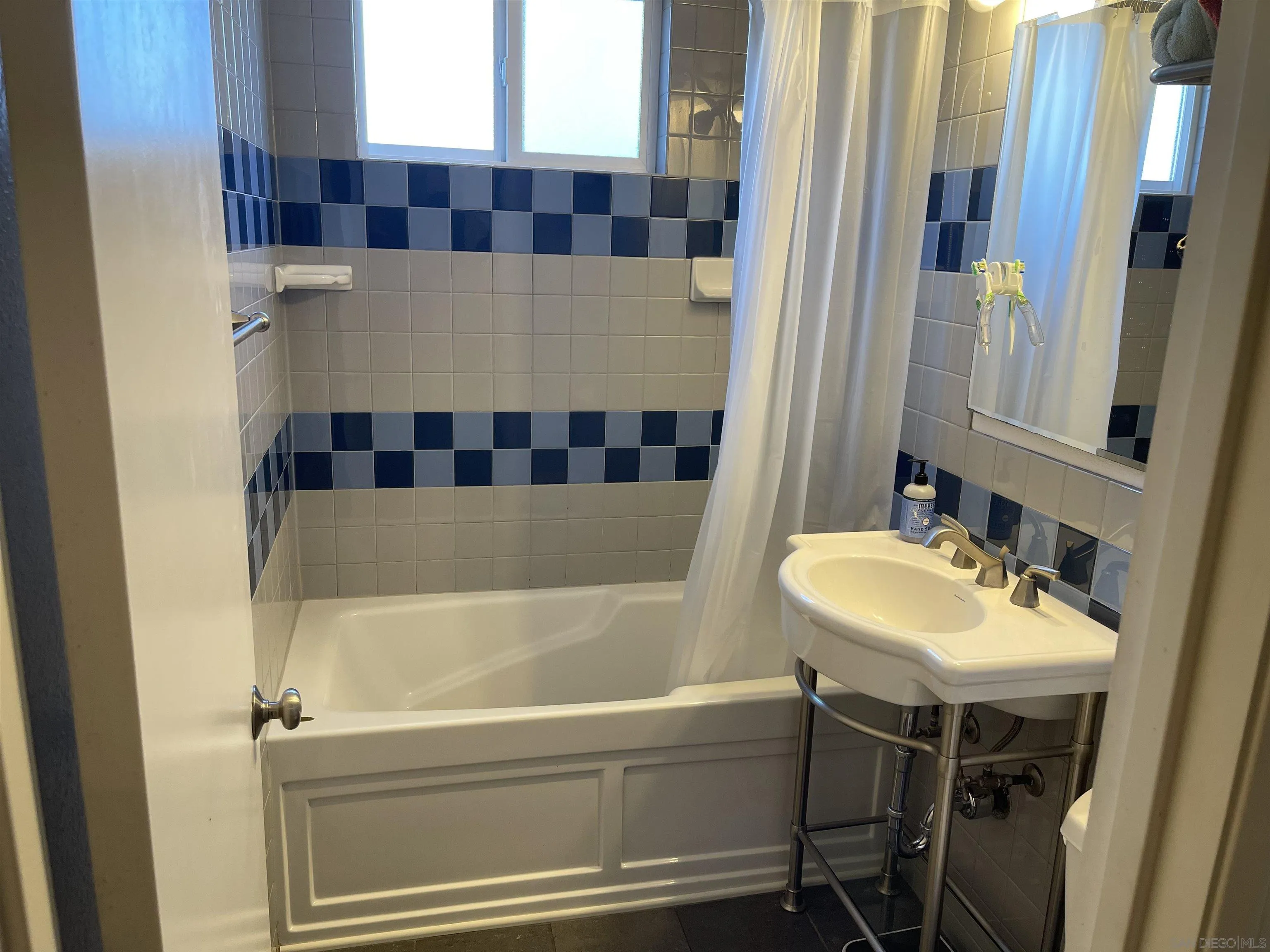 14150 Tobiasson Road Poway, CA 92064 - Photo 7 of 12 a bathroom with a sink and a bathtub