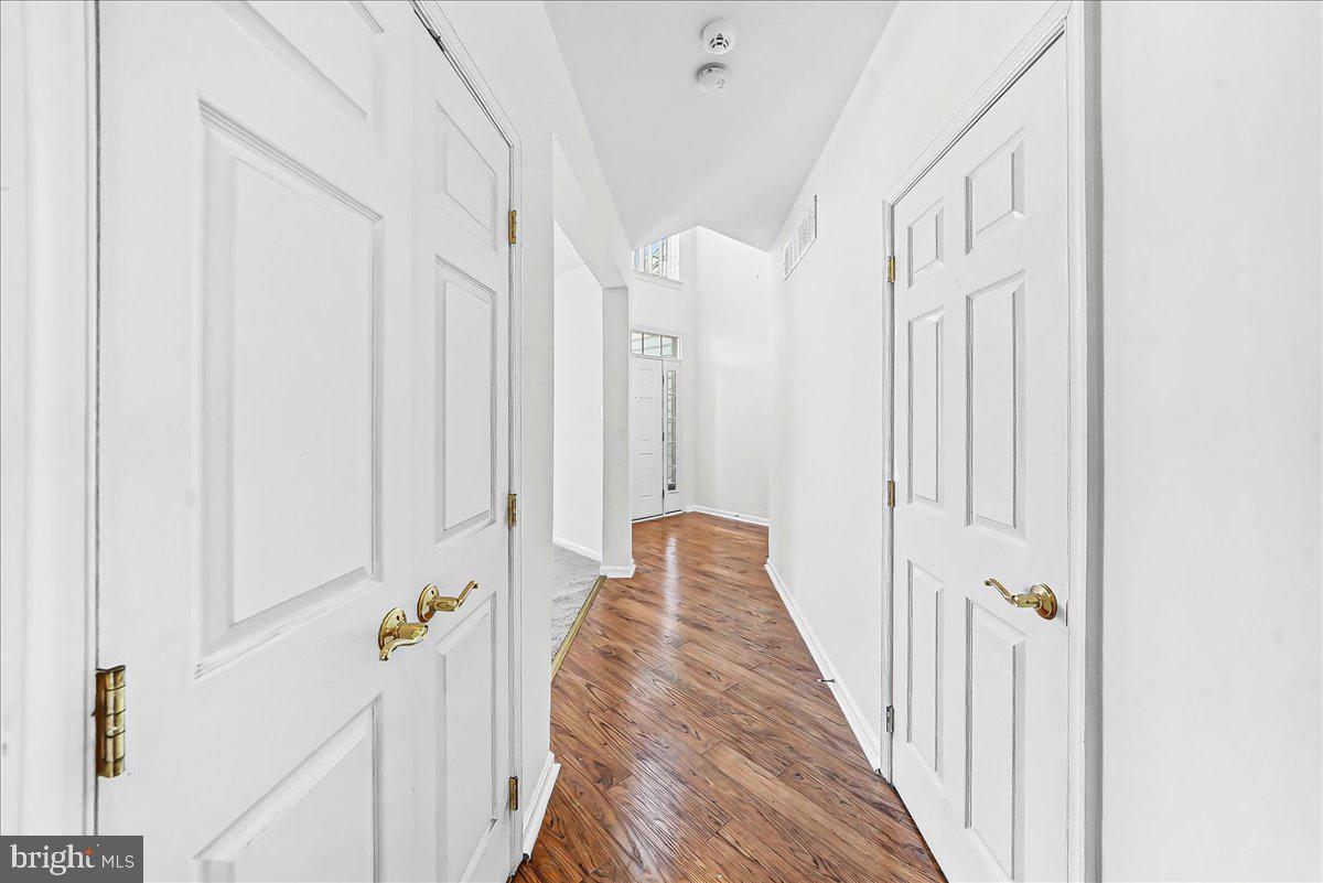 339 Pierce Run Newark, DE 19702 - Photo 4 of 37 a view of a hallway with wooden floor and staircase