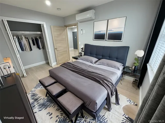 a bedroom with a bed and a mirror