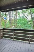 a view of room with wooden floor and a floor to ceiling window