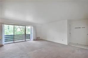 an empty room with a balcony