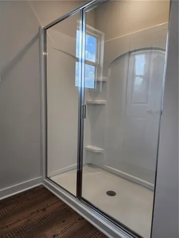 a bathroom with a double vanity sink and mirror