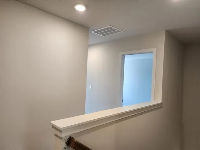 a bathroom with a toilet a sink and shower