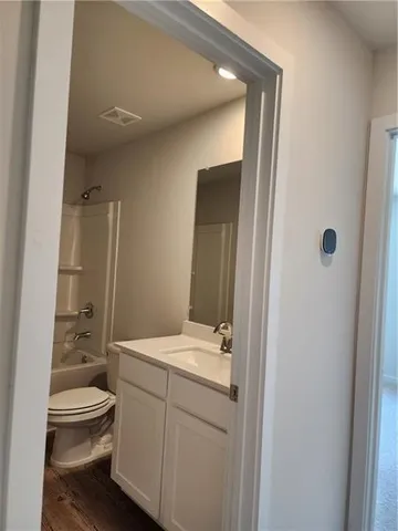 a view of a swimming pool with an outdoor seating and a yard