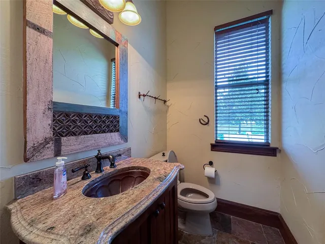 a bathroom with a sink and a toilet