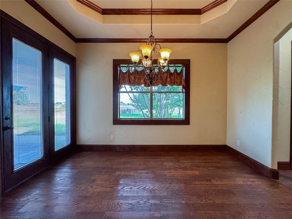 1559 East Blackjack Road East Pilot Point, TX 76258 - Photo 16 of 40 a view of a room with window wooden floor and door
