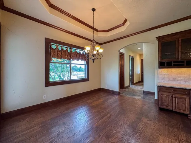 a view of a room with furniture wooden floor and window