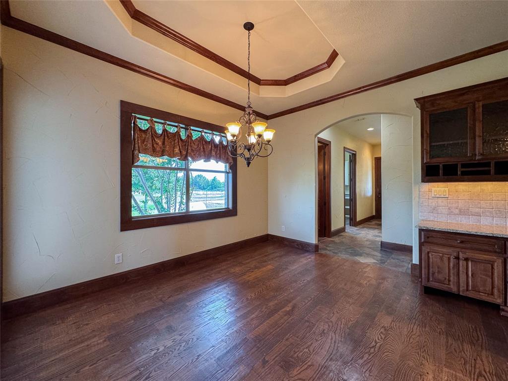 1559 East Blackjack Road East Pilot Point, TX 76258 - Photo 17 of 40 a view of a room with furniture wooden floor and window