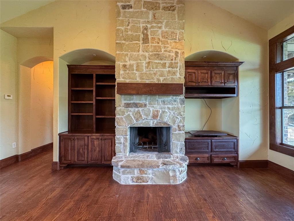 1559 East Blackjack Road East Pilot Point, TX 76258 - Photo 2 of 40 a living room with furniture and a fireplace