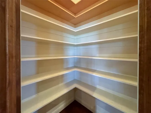 a storage room with wooden floor