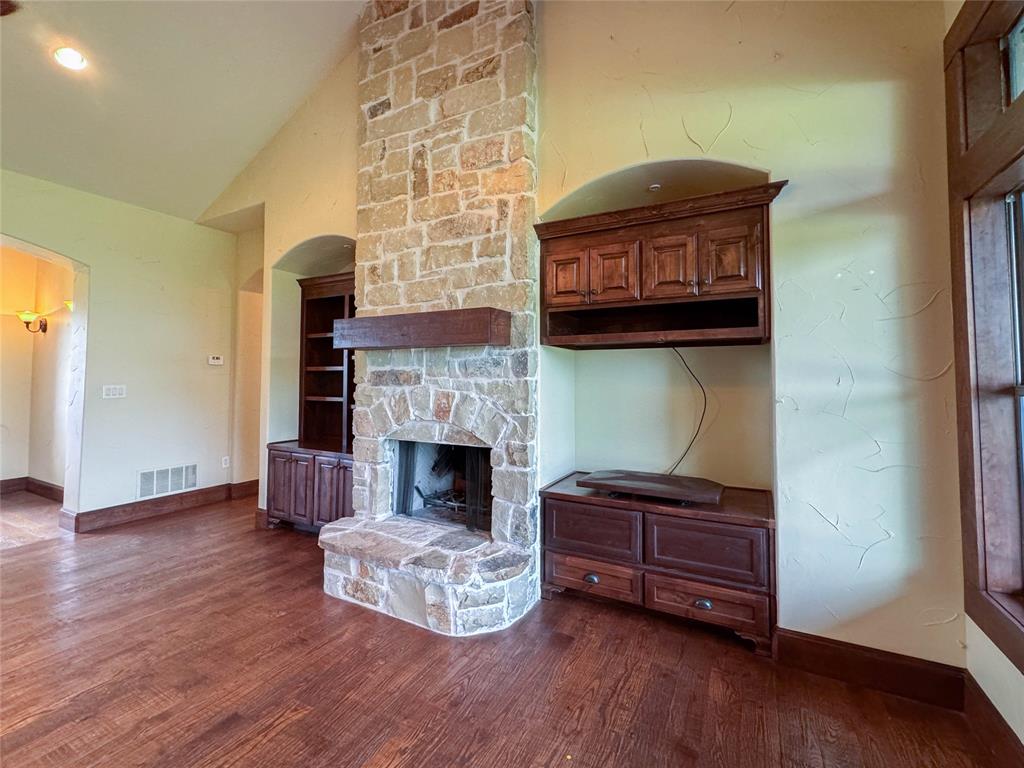 1559 East Blackjack Road East Pilot Point, TX 76258 - Photo 30 of 40 a living room with furniture and a fireplace