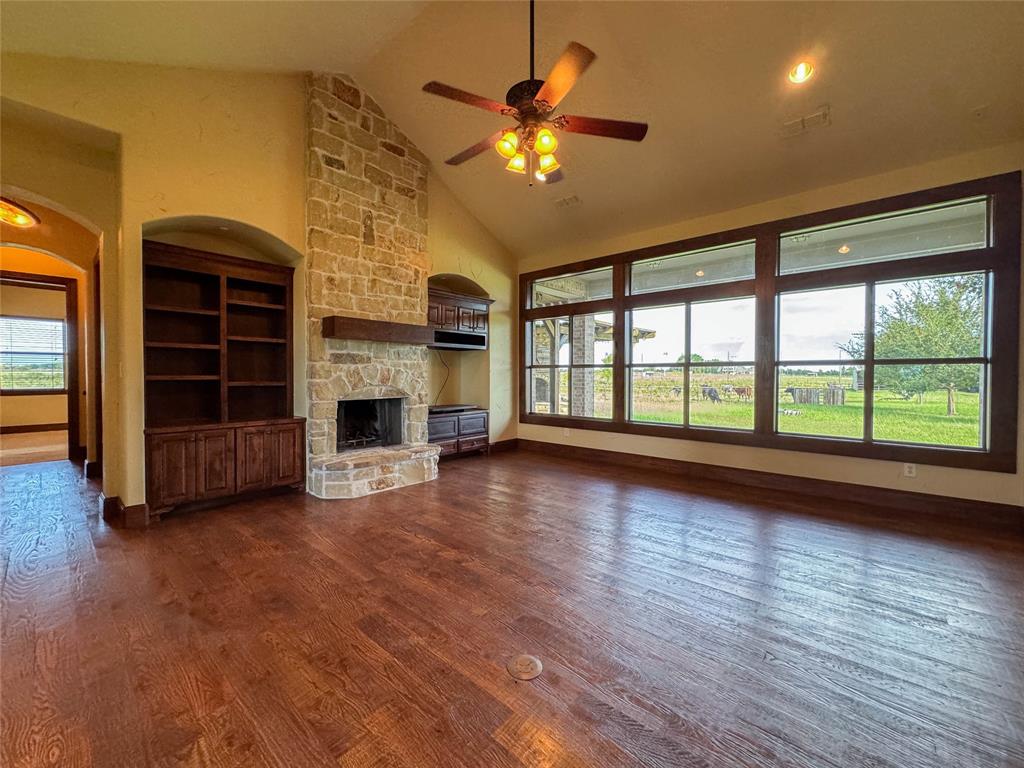 1559 East Blackjack Road East Pilot Point, TX 76258 - Photo 3 of 40 a view of an empty room with a fireplace and a window