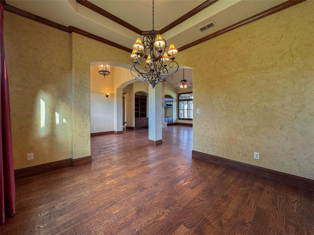 1559 East Blackjack Road East Pilot Point, TX 76258 - Photo 34 of 40 a view of a room with chandelier and wooden floor