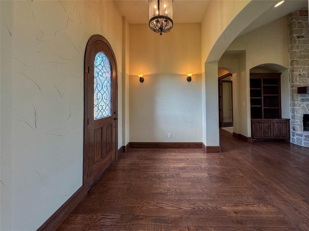 1559 East Blackjack Road East Pilot Point, TX 76258 - Photo 35 of 40 a view of a livingroom with wooden floor and entryway
