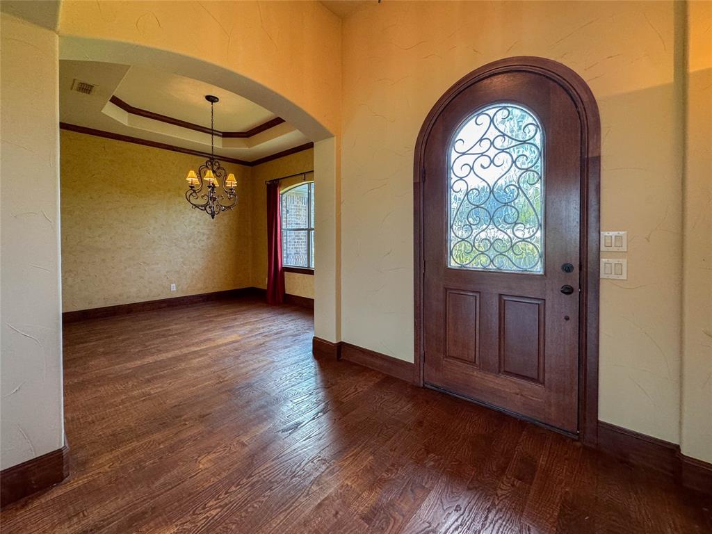 1559 East Blackjack Road East Pilot Point, TX 76258 - Photo 36 of 40 an empty room with wooden floor and windows