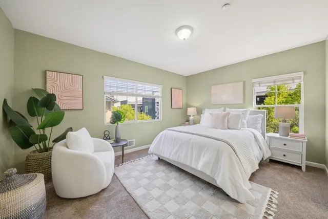 a bedroom with a bed and a couch