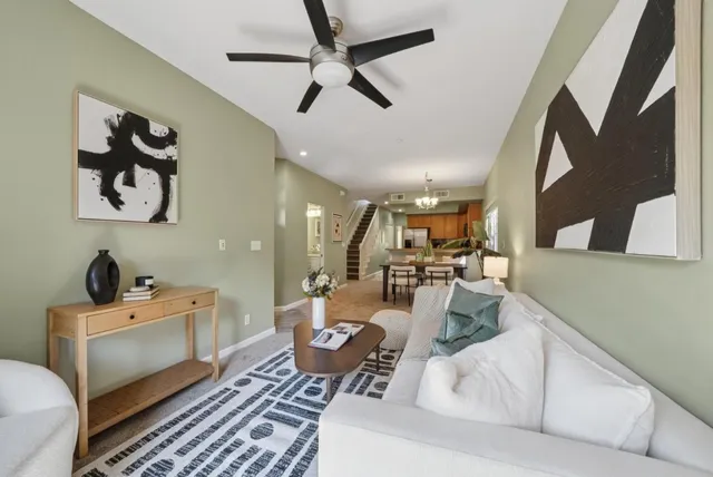 a living room with furniture and a rug
