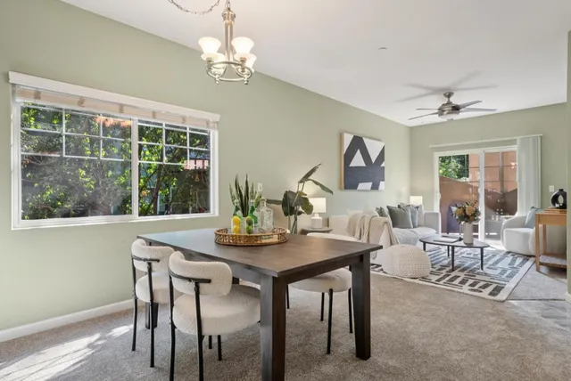 a view of a dining room with furniture window and outside view