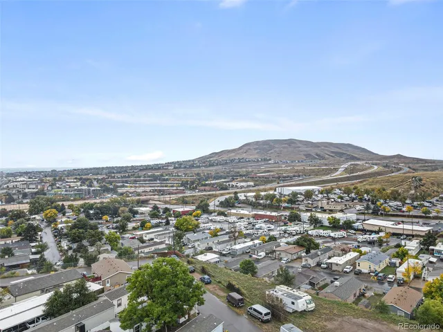 an aerial view of residential house and green space