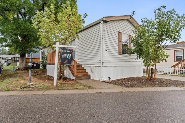 a house with trees in the background