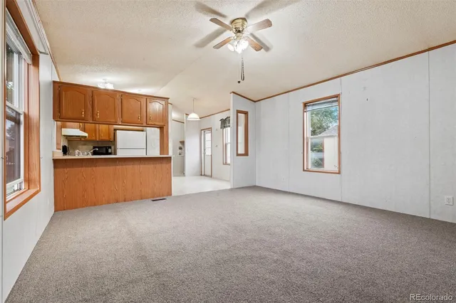a view of a kitchen with a sink and cabinet
