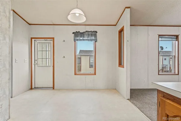 a view of an empty room with a window