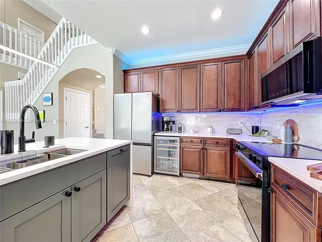 a bedroom with furniture and a large window