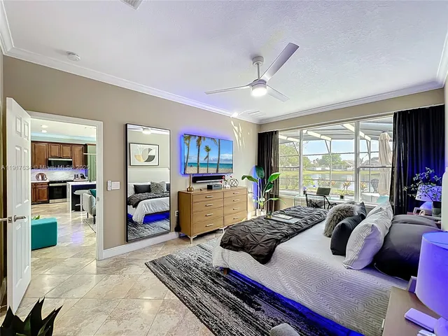 a living room with furniture a rug and a chandelier
