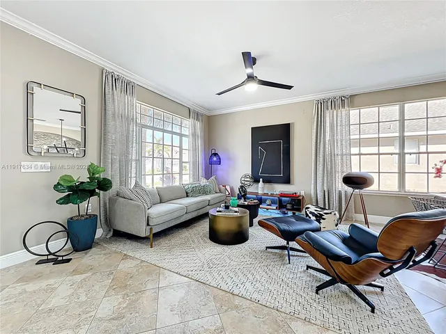 a living room with furniture rug and window