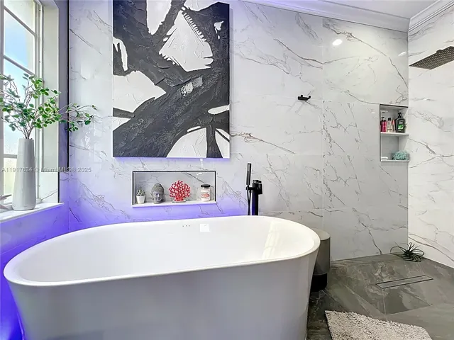 a bedroom with a bed a table and chair