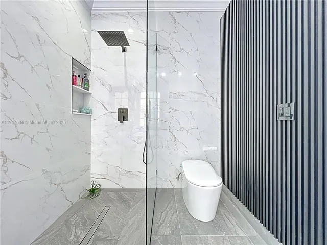 a bedroom with bed and a window