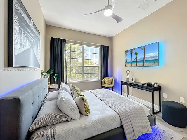 a view of a chair and table in backyard of the house