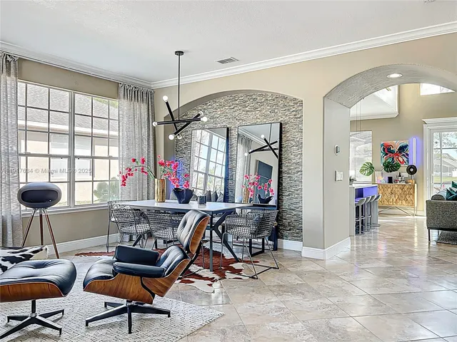 a kitchen with stainless steel appliances a sink a stove and cabinets