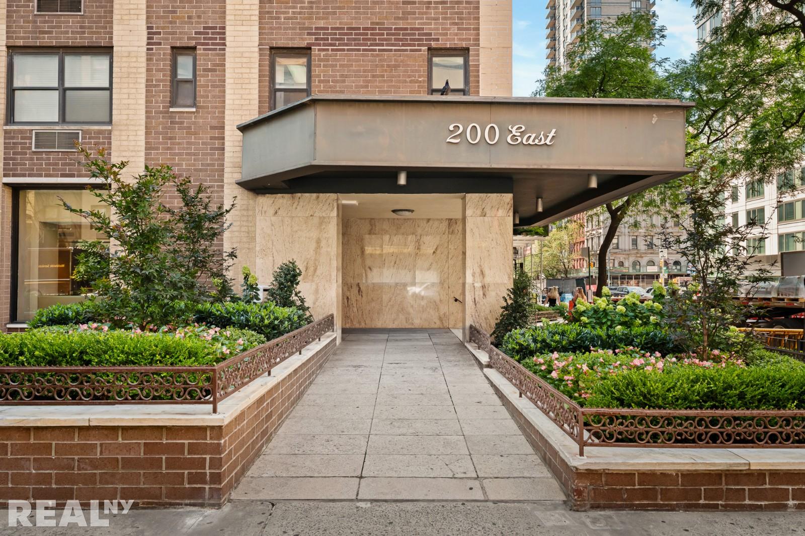 200 East 24th Street, Unit 706 Manhattan, NY 10010 - Photo 16 of 17 a view of a street with potted plants