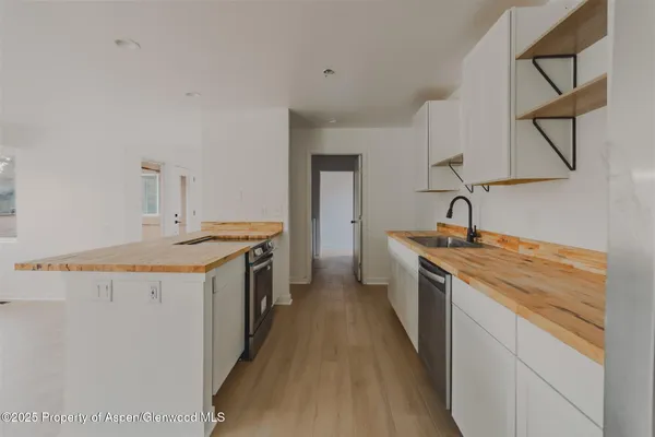 a kitchen with a stove and a sink