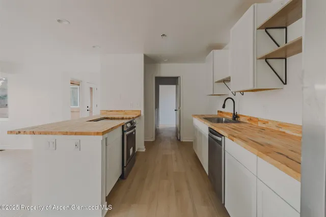 a kitchen with a stove and a sink